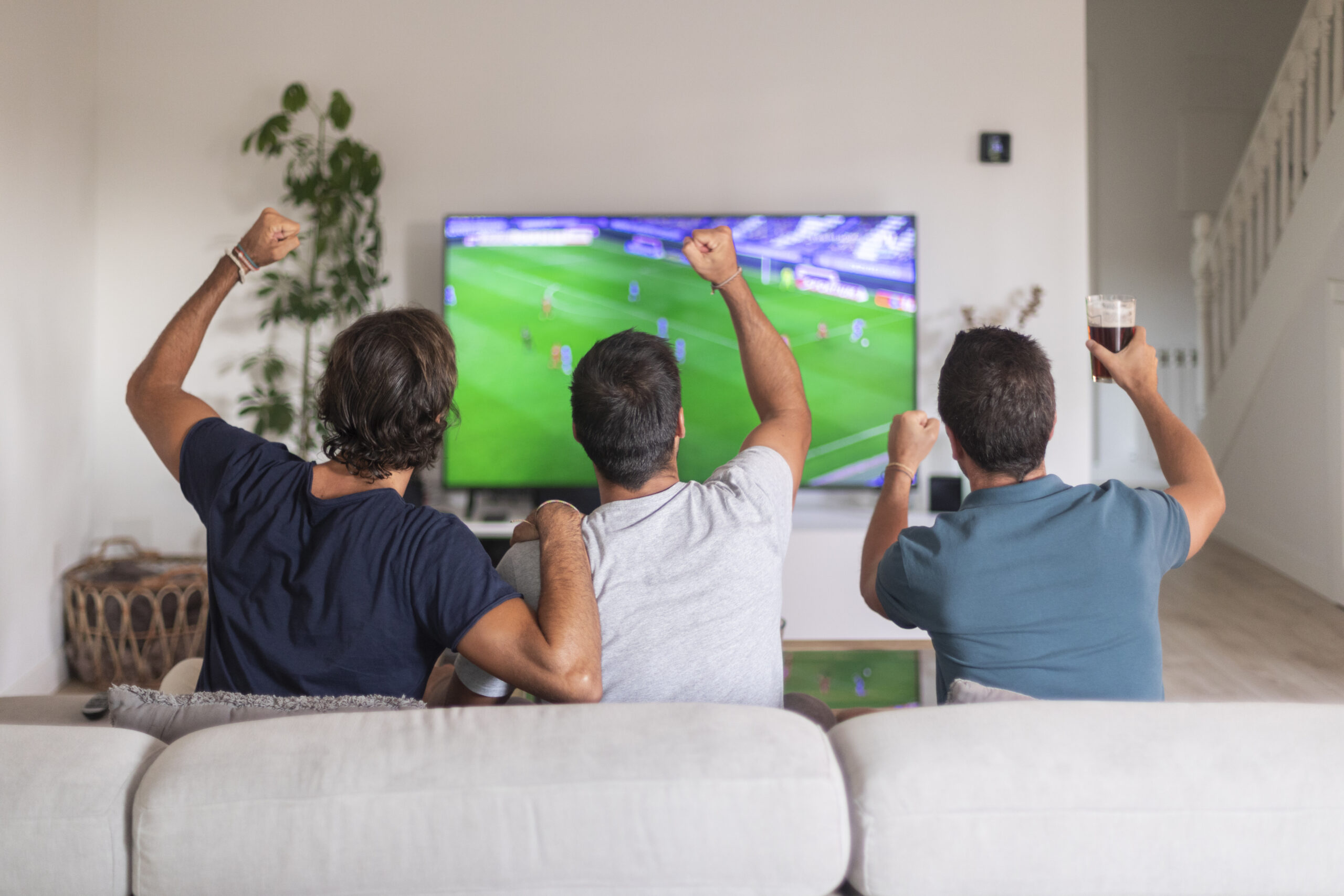 group-friends-watching-game-tv-celebrating-victory-their-team-scaled